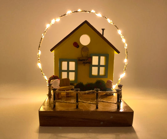 The Weaver's Nest Yellow Cottage with String Lights