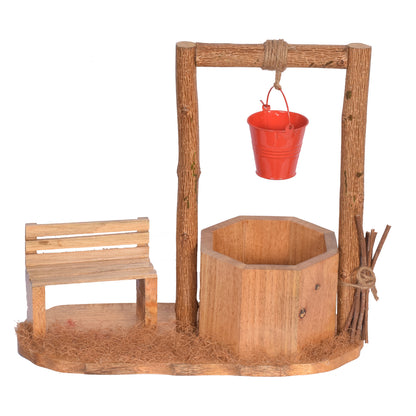 The Weaver's Nest Wishing Well Planter with Figurines sitting on Bench